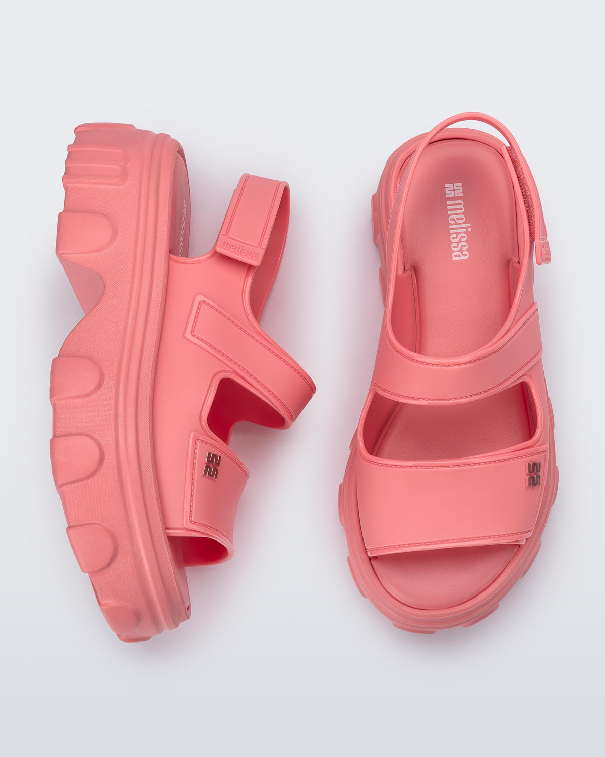 Top and side view of a pair of pink Ella Move platform sandals.
