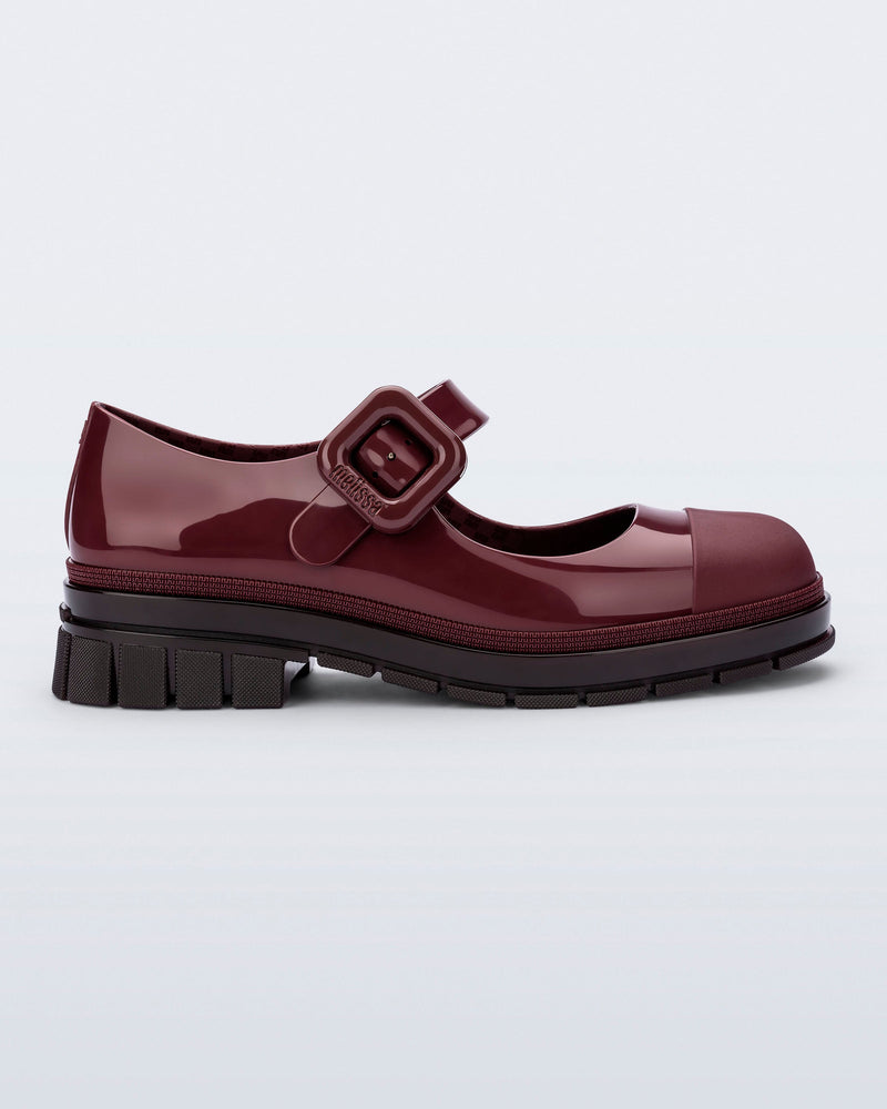 Side view of a burgundy June mary jane with matte toe cap