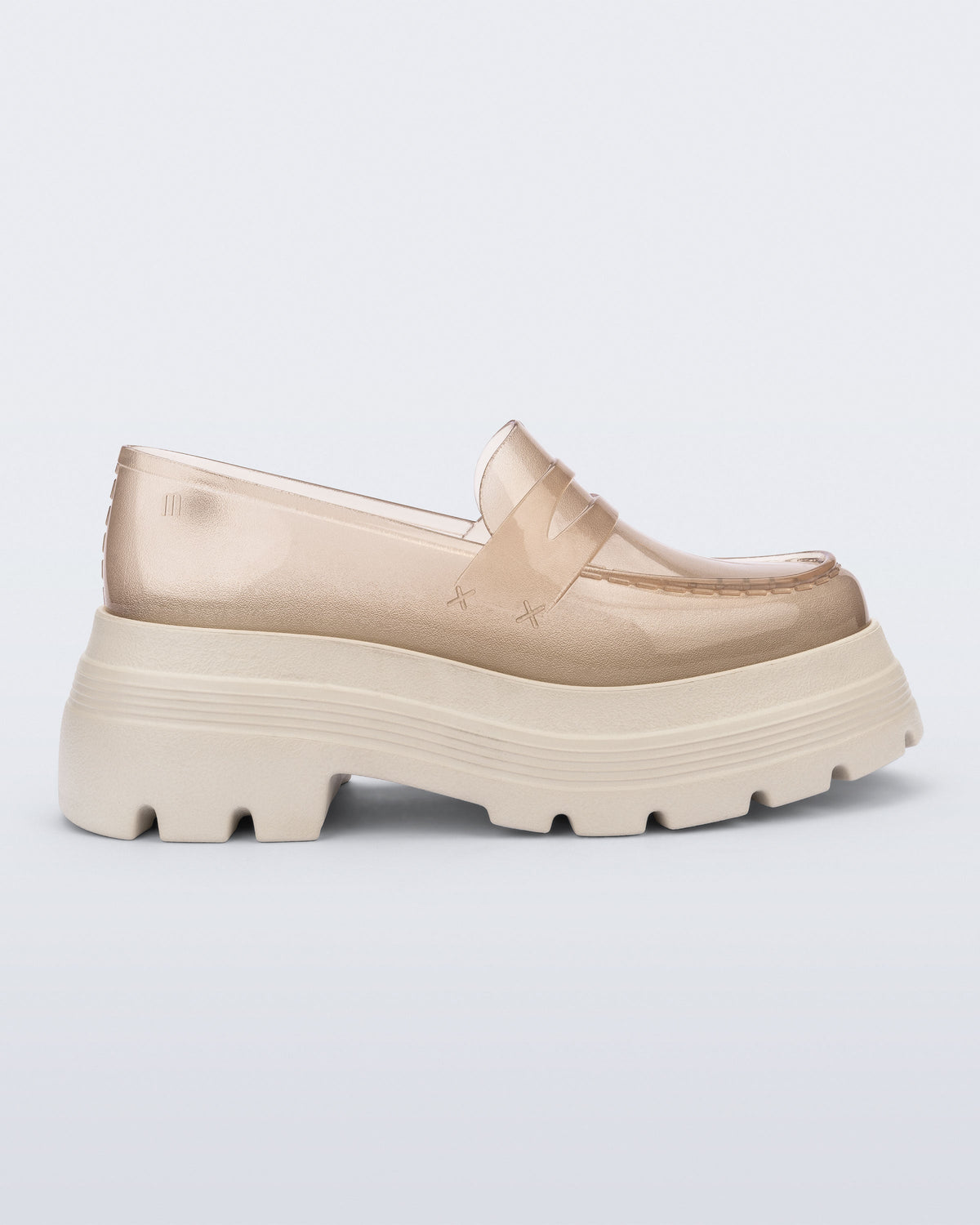 Side view of a transparent beige Royal High + Undercover platform loafer with beige sole.