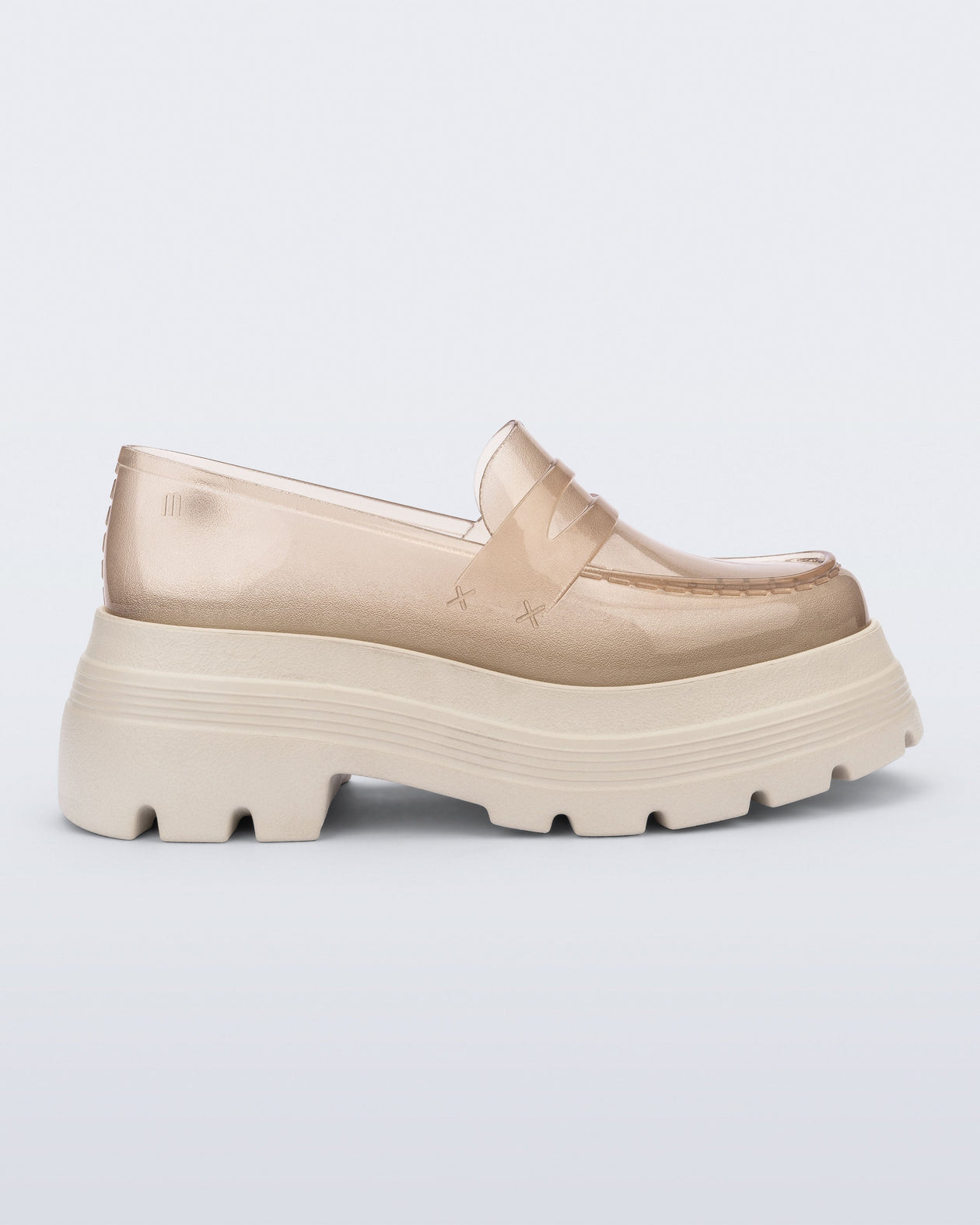 Side view of a transparent beige Royal High + Undercover platform loafer with beige sole.
