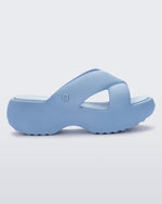 Side view of a blue Free Rise platform slide sandal