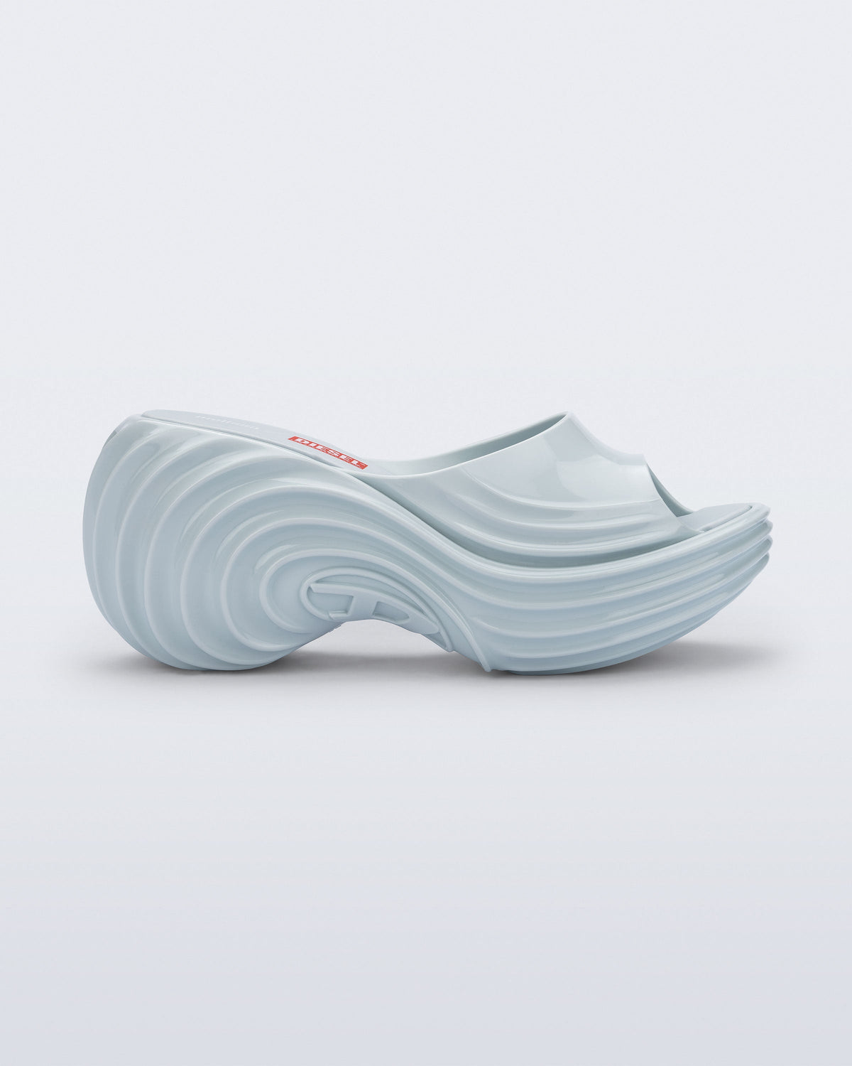 Side view of a light blue Platforms + Diesel slides