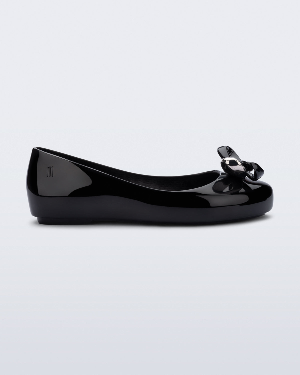 Side view of a black Sweet Love Glam kids ballerina flats with bow