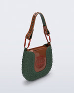 Angled view of a dark green Nina Bag + Alexandre Pavao shoulder bag with brown accents