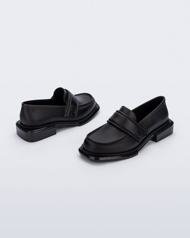 Back and angled view of a pair of black Spencer loafers