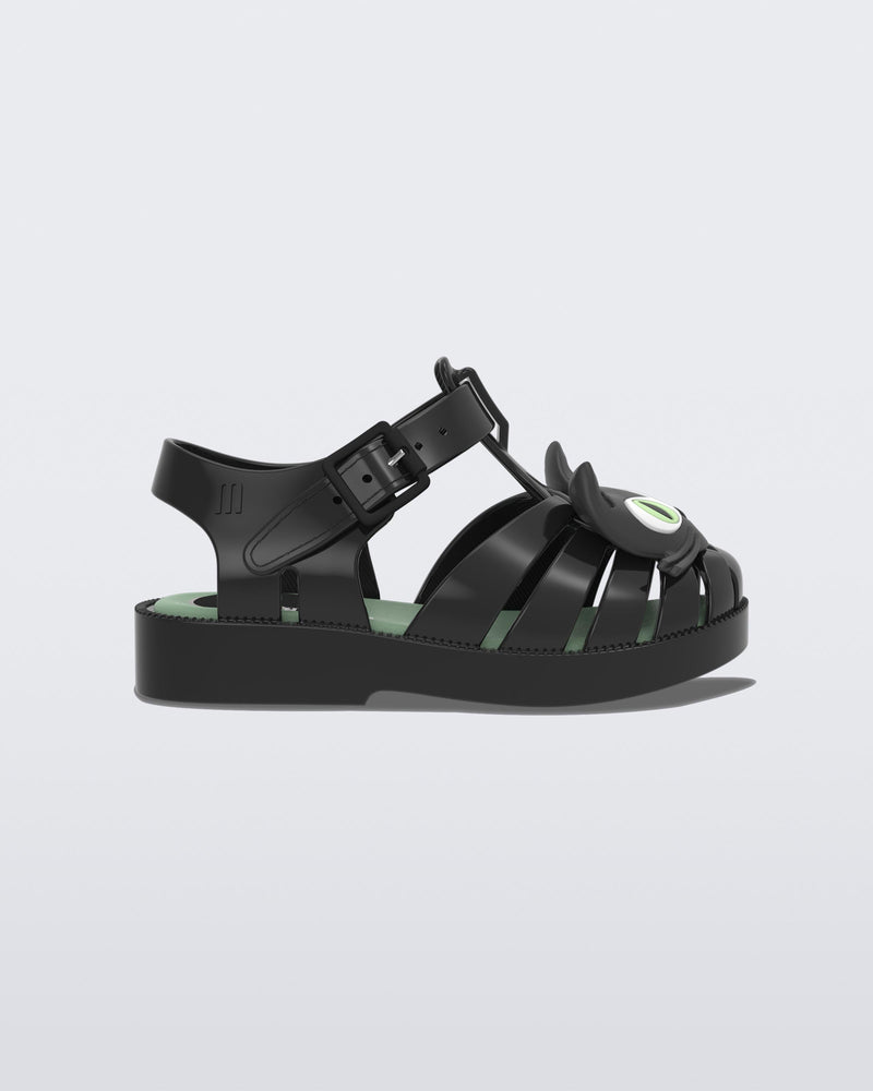 Side view of a black baby Possession Cat flat