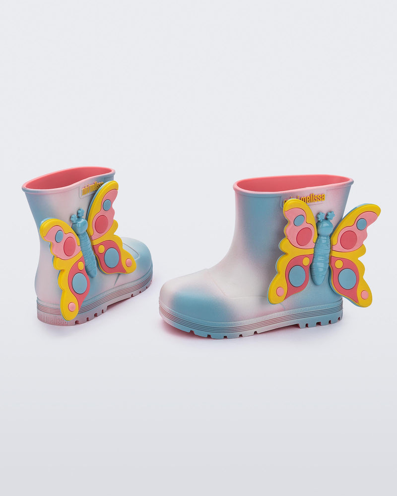 back and side view of a pair of pink with blue splotches Welly Wonderland baby boot with yellow/blue butterfly on side