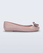 Side view of a pink Sweet Love Glam ballerina flat with pink chrome bow