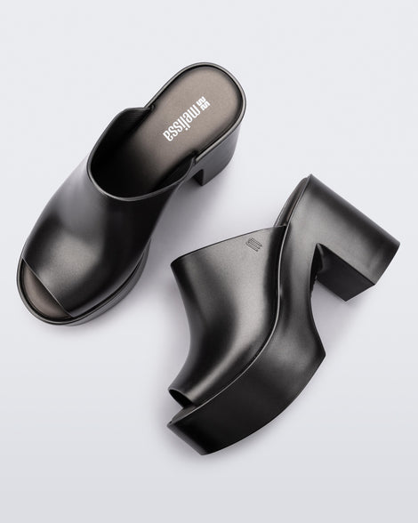 Top and side view of a pair of dark silver Mule Hype Platforms