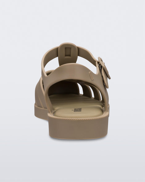 A back view of a pair of Dark Beige Melissa Possession sandals with several straps and a closed toe front.