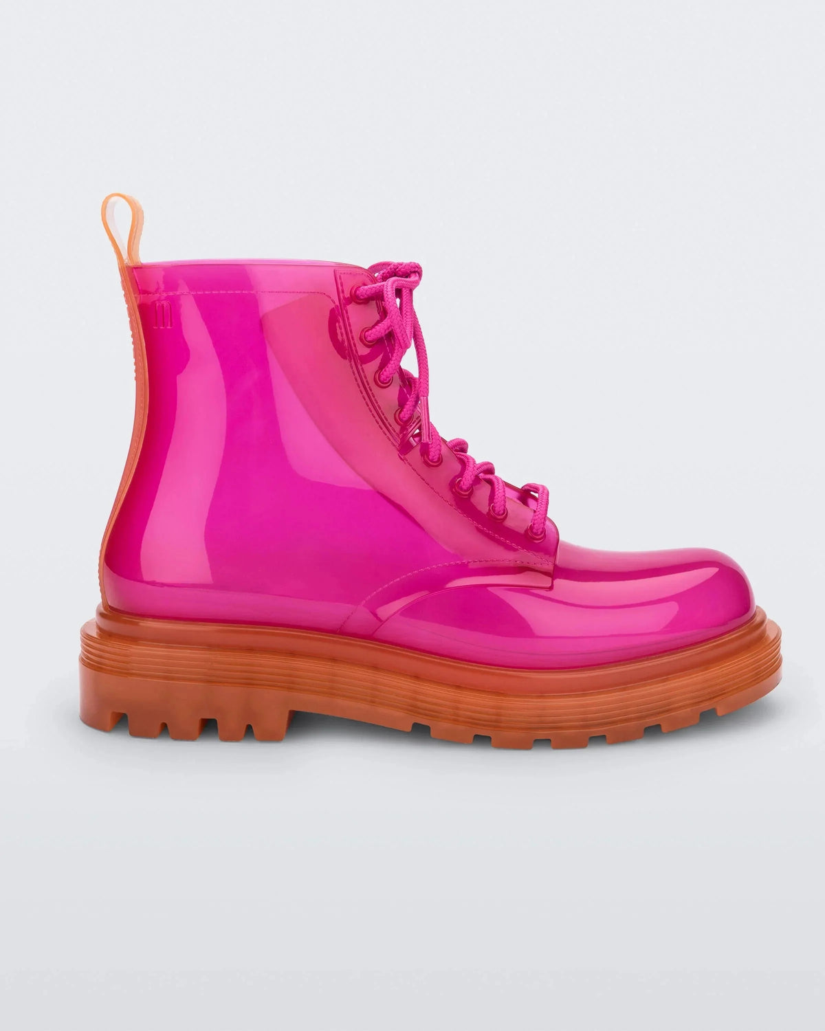 Side view of a pair of a clear orange / pink Melissa Coturno boots with a pink base, laces and an orange sole.