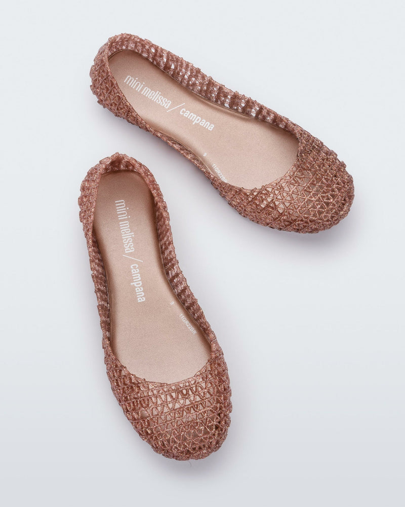 Top view of a pair of rose glitter Mini Melissa Campana flats with a woven detail base.