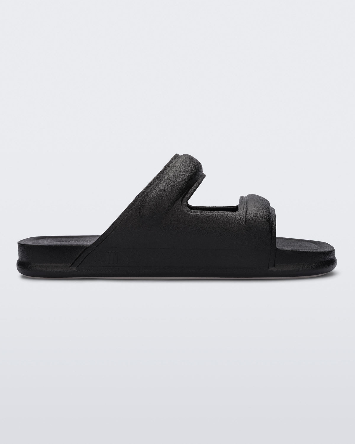 Side view of a black Melissa Free Grow slide with a square cut out on the front.