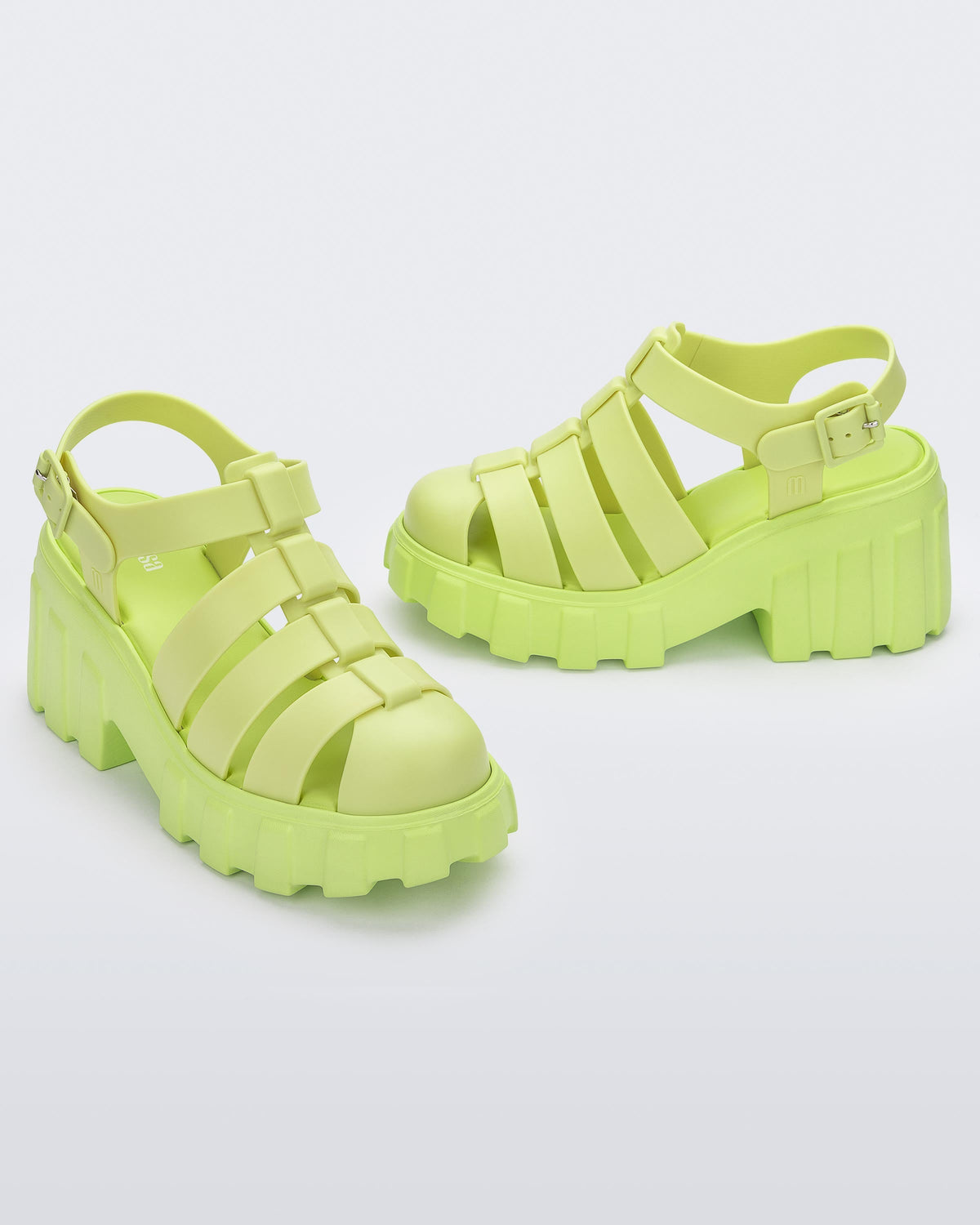 Angled view of a pair of yellow Melissa Megan platform heel sandal.