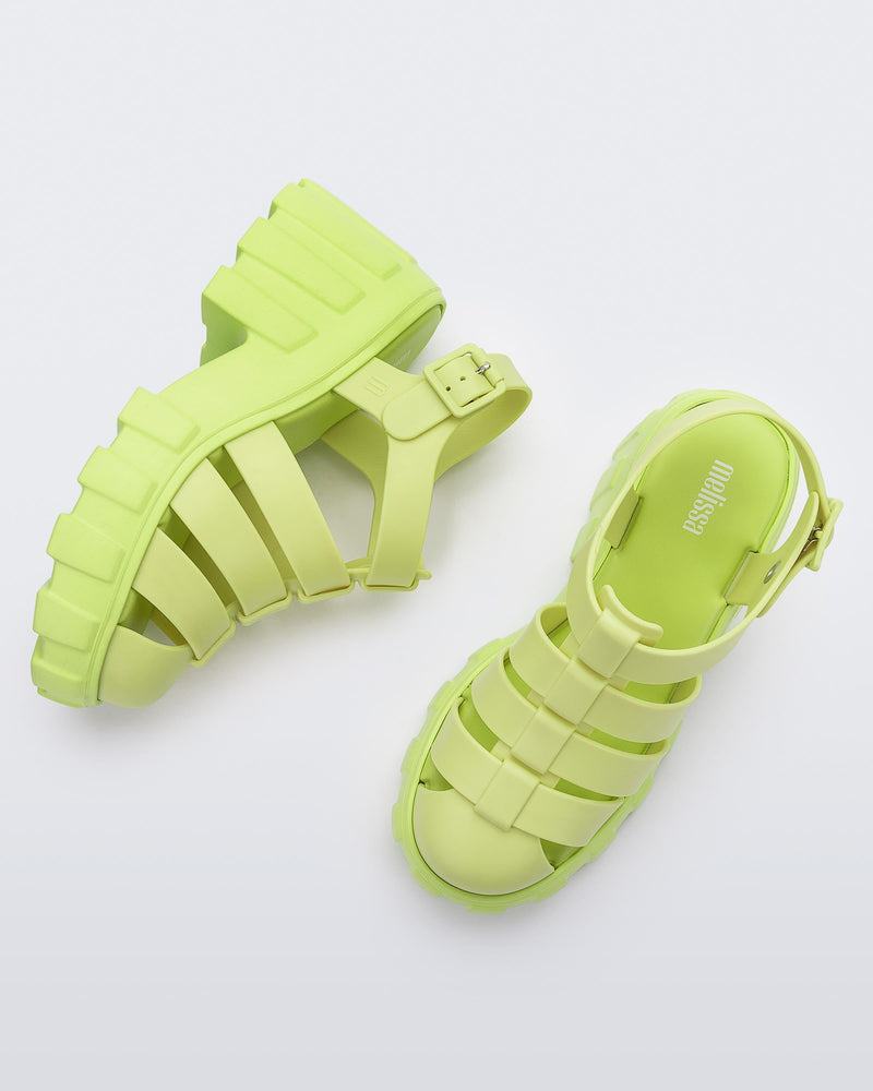 Top and side view of a pair of yellow Melissa Megan platform heel sandal.