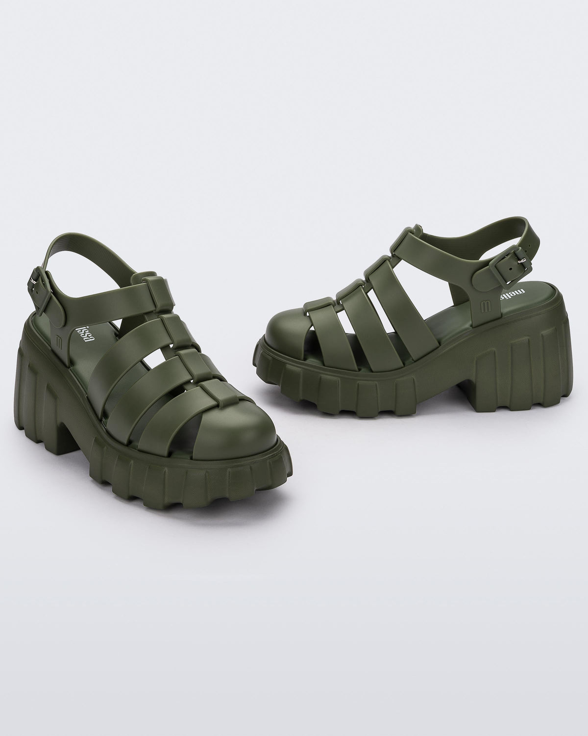 Angled view of a pair of dark green Melissa Megan Platform heels.
