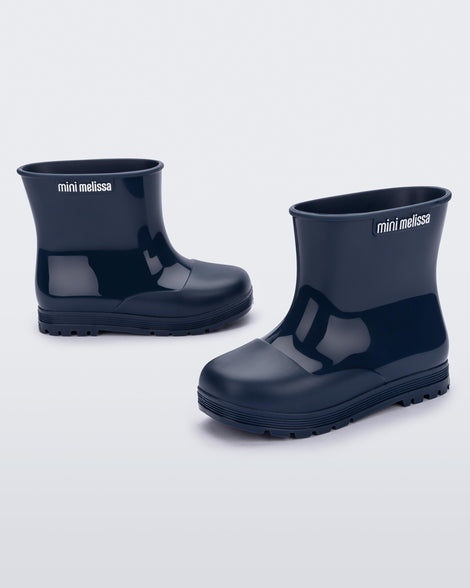 Angled view of a pair of blue baby Melissa Welly boots.