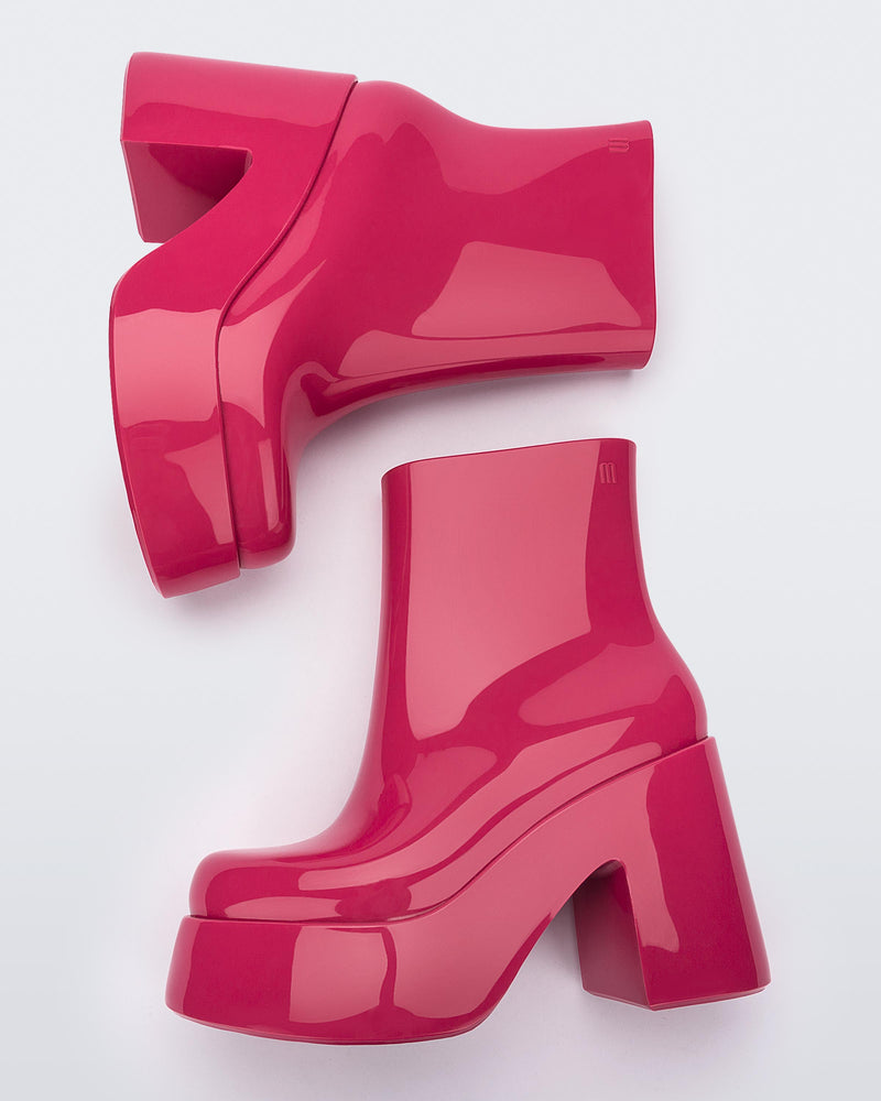 Top view of a pair of pink Melissa Nubia platform heel boots.