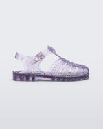 Side view of a clear lilac Possession kids sandal with star glitter