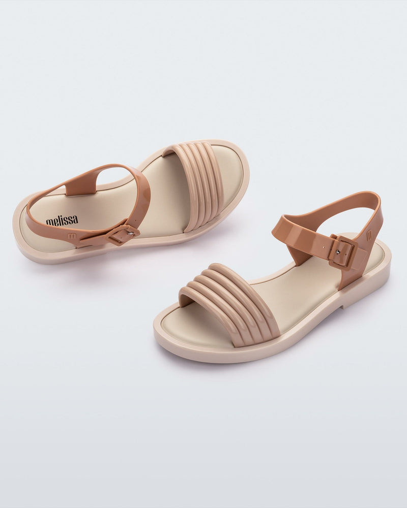 Angeld view of a pair of beige Mar Wave women's sandals.