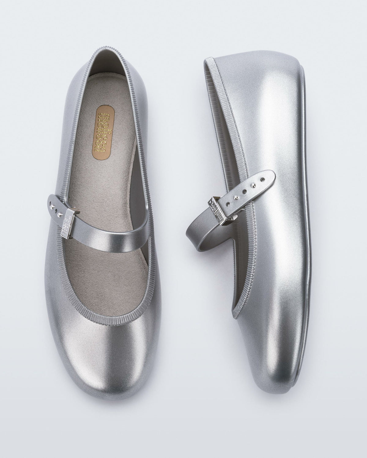 Top and side view of a pair of silver Soft Ballerinas.