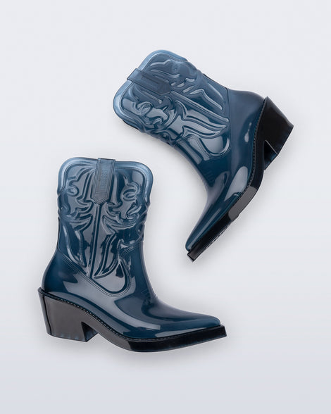 Side view of a pair of transparent blue Texas Boots with pointed toe and black sole