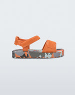 Side view of a orange baby Imagine sandal