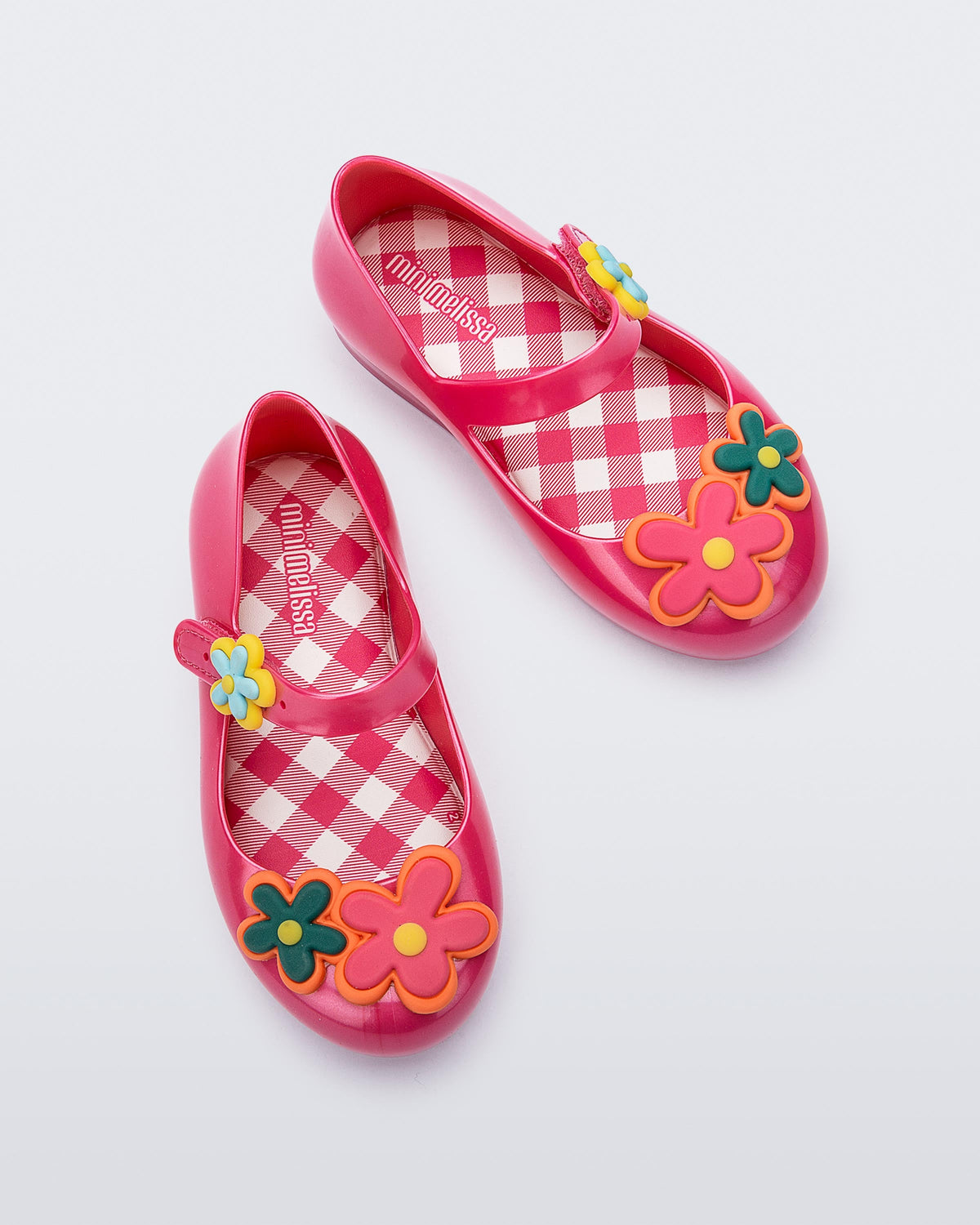 Top view of a pair of pink Sweet Love Picnic baby flats with flowers
