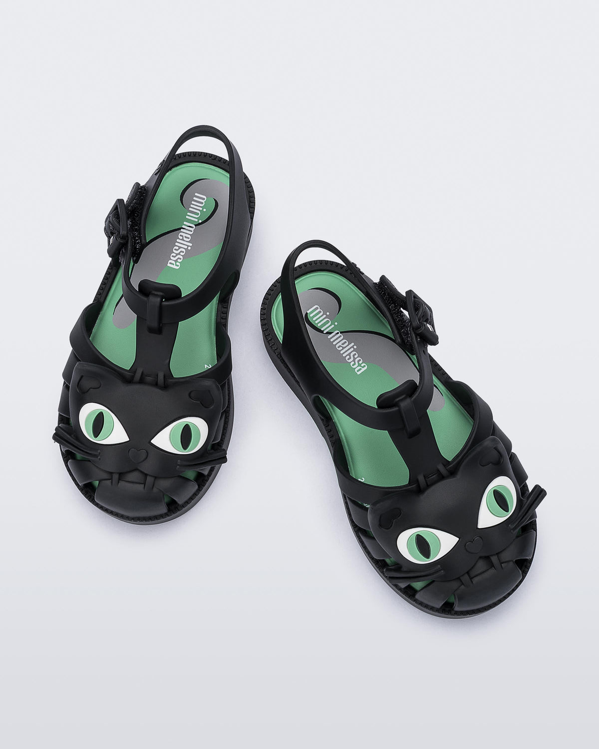 Top view of a pair of black baby Possession Cat sandals
