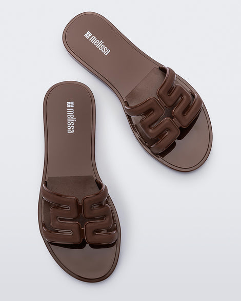 Top view of a pair of brown M Slides.