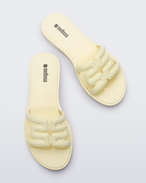 Top view of a pair of beige M Slides