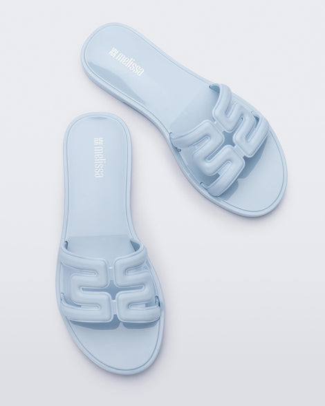 Top view of a pair of light blue M Slides.