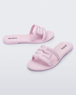 Angled view of a pair of light pink M Slides.