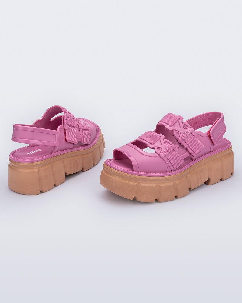 Side and back view of a pair of Pink Rebel platform Sandals with back strap.
