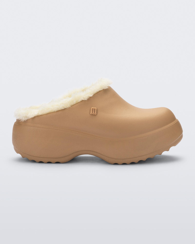 Side view of a dark beige Free Clog Fluffy Platform with light beige fluffy liner
