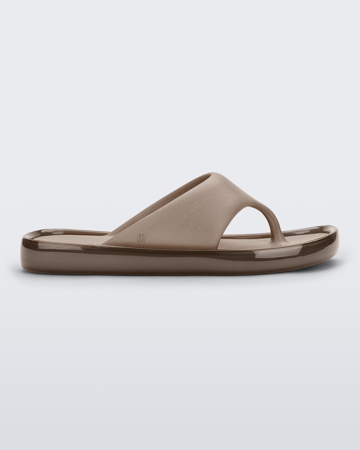 Side view of a beige Float flip flop