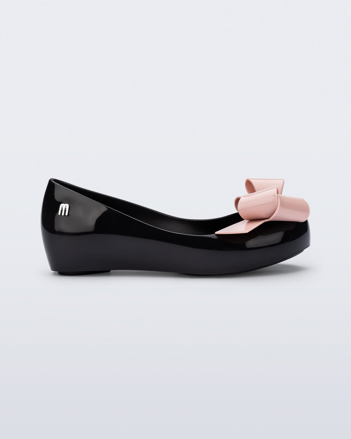 Side view of a black Ultragirl Classy kids ballerina with pink bow.