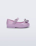Side view of a lilac Sweet Love Glam baby ballerina with bow