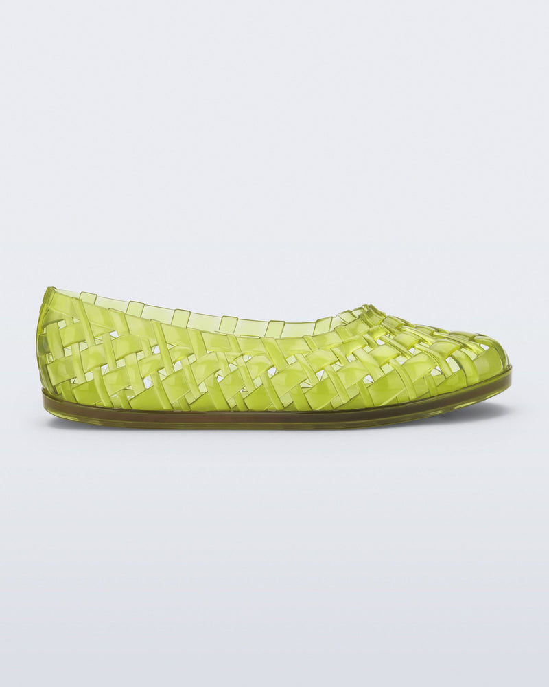 Side view of a clear green Possession Ballerina flat