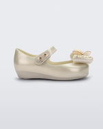Side view of a Mini Melissa Ultragirl peeptoe ballet flat for baby in white with star printed butterfly bow applique.