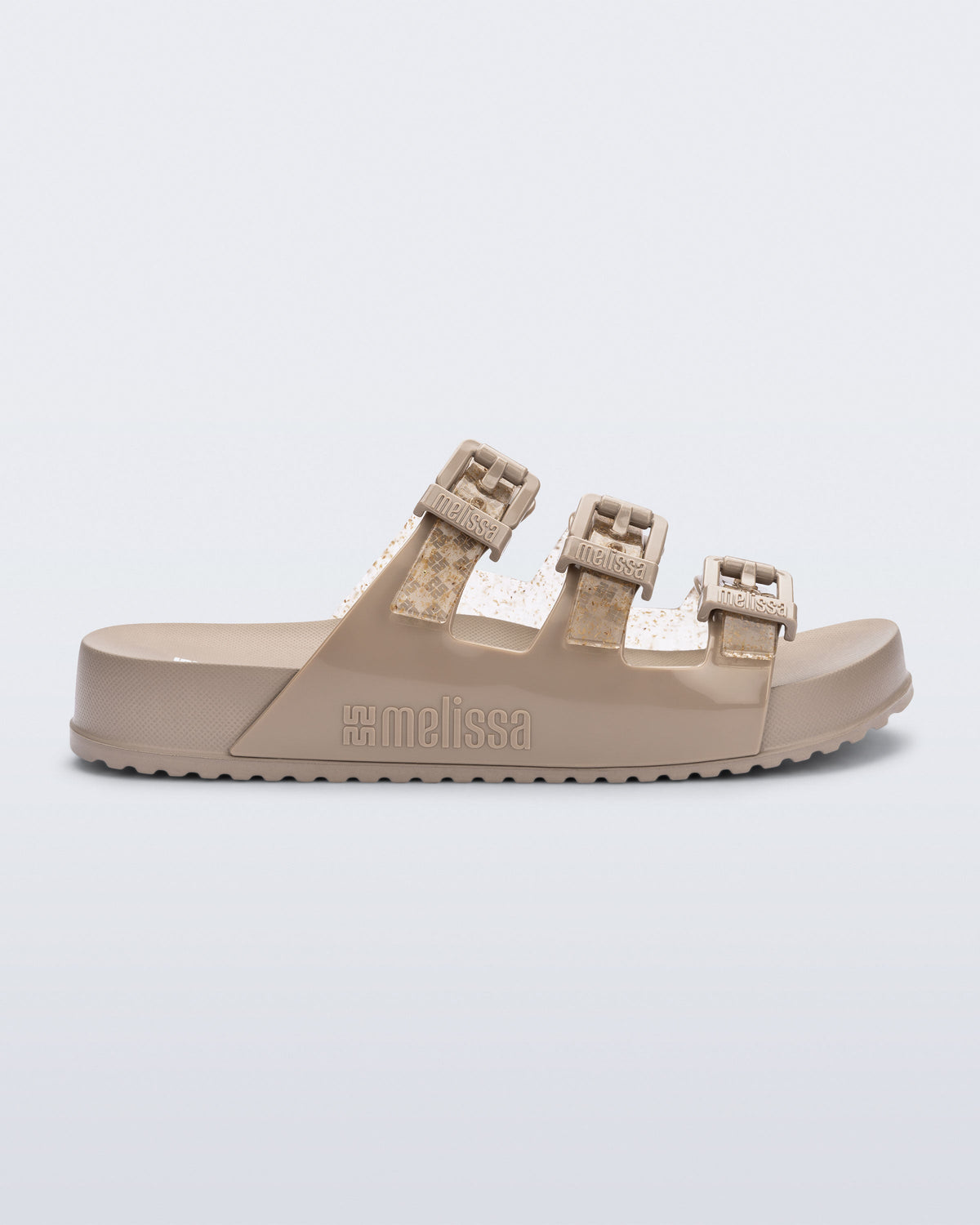 Side view of a beige Cozy Stripe slide