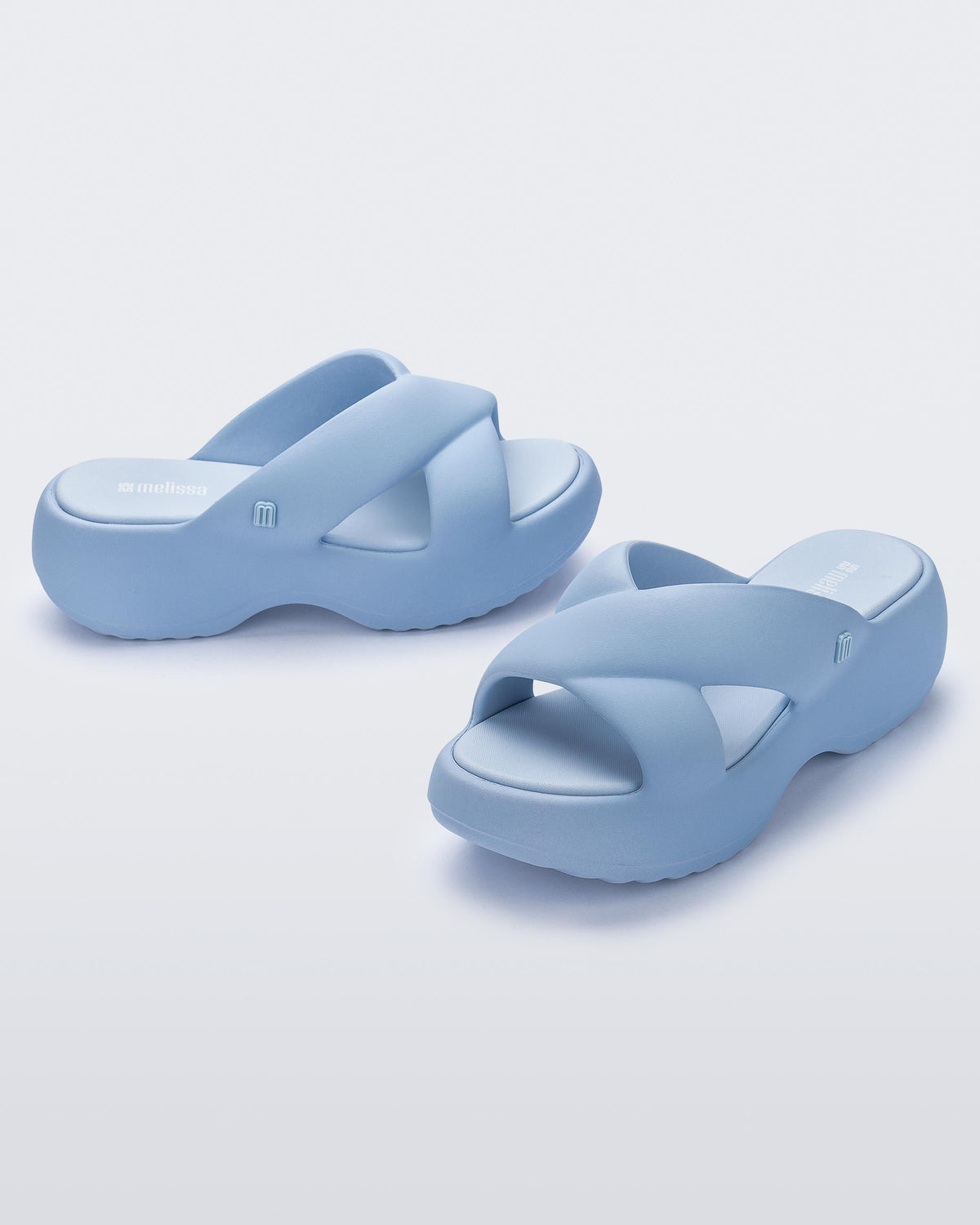 Side and angled view of a pair of blue Free Rise platform slide