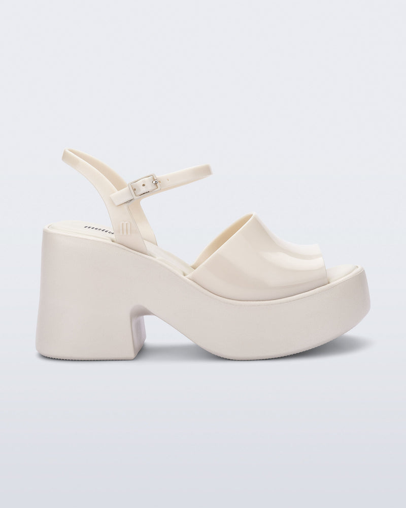 Side view of a beige Lina platform heel