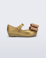 Side view of a pearly beige baby Ultragirl Classic Bow flats