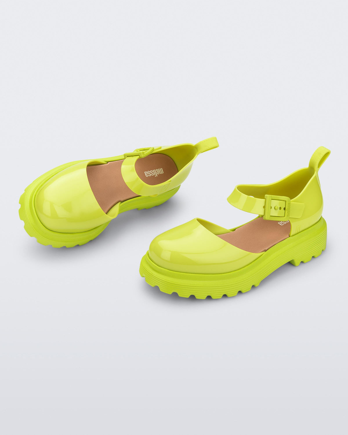 Side and angled view of a pair green Ellie ankle strap loafers