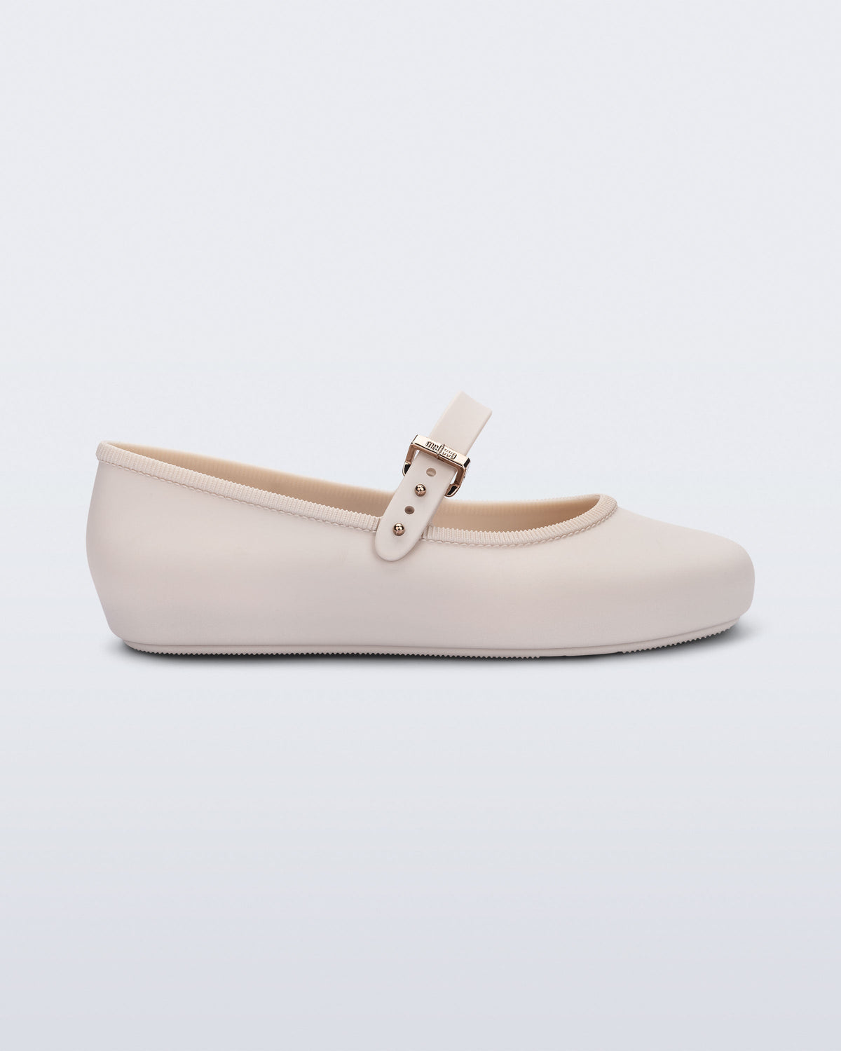 Side view of a beige Soft Ballerina kids flat with strap