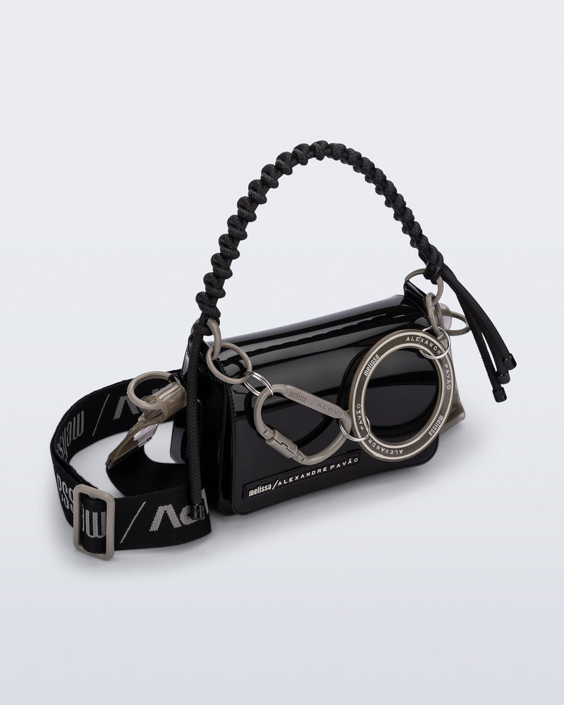 Angled view of an black Olga Bag + Alexandre Pavao with short strap fabric long strap