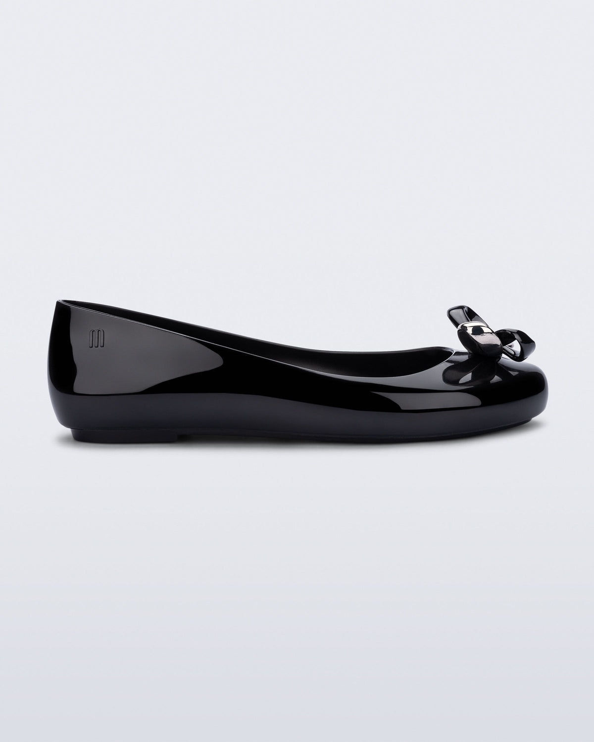 Side view of a black Sweet Love Glam ballerina flat with chrome bow