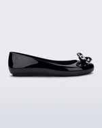 Side view of a black Sweet Love Glam ballerina flat with chrome bow