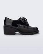Side view of a black Tailor loafer with laces